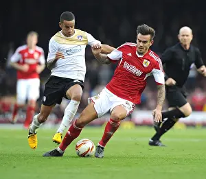 Bristol City V Colchester United Prints: Maron Pack vs Craig Eastmond: Battle for Supremacy in Bristol City vs Colchester United Football Match