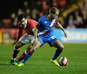 Maron Pack vs. James Coppinger: Intense Battle for the Ball at Ashton Gate Stadium - FA Cup Third Round Replay