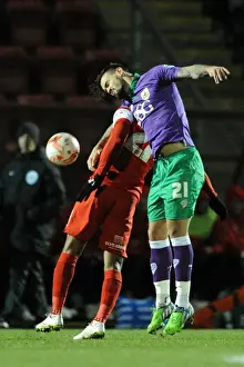 Leyton Orient V Bristol City Prints: Maron Pack vs Jay Simpson: Intense Aerial Battle in Leyton Orient vs Bristol City Football Match