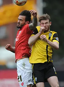 Bristol City V Barnsley Prints: Maron Pack vs. Sam Winnall: Intense Aerial Battle at Ashton Gate