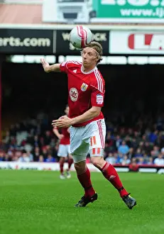 Bristol City V Ipswich Town Prints: Martyn Woolford in Action: Championship Clash between Bristol City and Ipswich Town