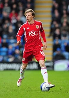 Images Dated 17th March 2012: Martyn Woolford of Bristol City in Action at Fratton Park against Portsmouth, 2012