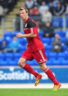 Images Dated 28th July 2012: Martyn Woolford of Bristol City in Action against St Johnstone at McDiarmid Park