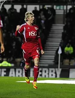 Images Dated 10th December 2011: Martyn Woolford Scores: Derby County Championship Match, 10/12/2011 - Bristol City's Victory Moment