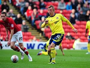 Images Dated 29th October 2011: Martyn Woolford Slides for Bristol City in Barnsley Championship Clash, October 2011