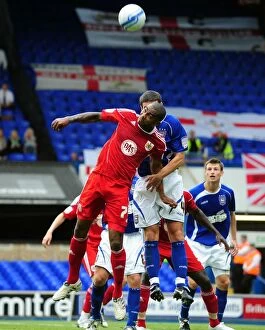 Images Dated 28th August 2010: Marvin Elliott Battles for Aerial Ball in Ipswich vs. Bristol City Championship Clash, 2010