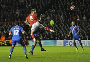 Images Dated 13th January 2015: Matt Smith Charges Towards Goal: Intense Moment from Bristol City vs Doncaster Rovers FA Cup Match