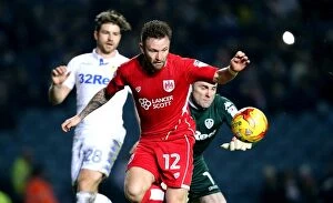 Images Dated 14th February 2017: Matty Taylor Outmuscles Robert Green: A Pivotal Moment in Leeds United vs. Bristol City, 2017