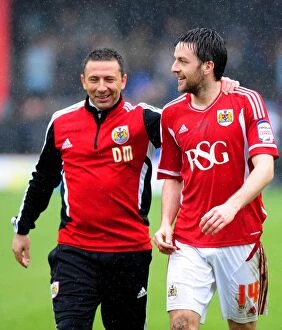 Bristol City v Coventry City Collection: McInnes Triumphant Moment with Skuse: Bristol City's Victory Over Coventry City, April 9, 2012