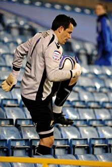 Images Dated 12th April 2011: Millwall's Goalkeeper David Forde Kicks Off Empty Championship Match Against Bristol City