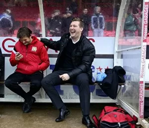 Images Dated 18th January 2014: Milton Keynes Dons Manager Karl Robinson Shares a Light-Hearted Moment with His Bench Before