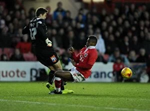 Images Dated 13th December 2014: Narrowly Beating Kieran Agard to the Ball: A Tense Moment in Bristol City vs Crawley Town Football