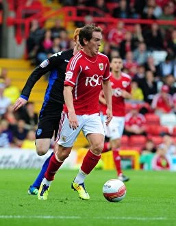 Images Dated 20th August 2011: Neil Kilkenny in Action: Bristol City vs. Portsmouth, Championship Clash at Ashton Gate Stadium