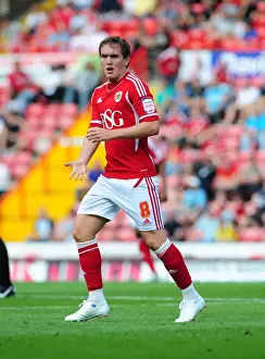 Season 11-12 Prints: Neil Kilkenny Faces Off Against West Brom in Intense Championship Clash at Ashton Gate