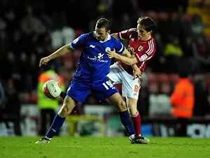 Images Dated 6th March 2012: Neil Kilkenny vs. Richard Wellens: Battle for the Ball in Bristol City vs
