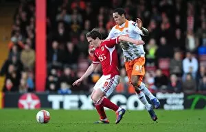 Images Dated 25th February 2012: Neil Kilkenny vs. Thomas Ince: Intense Battle at Ashton Gate, Bristol City vs. Blackpool, 2012