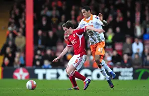 Bristol City V Blackpool Prints: Neil Kilkenny vs. Thomas Ince: Intense Battle at Ashton Gate