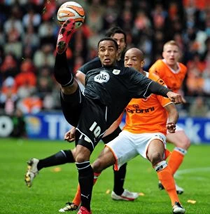 Images Dated 2nd May 2010: Nicky Maynard Flips Over John-Baptiste: Championship Clash Between Blackpool