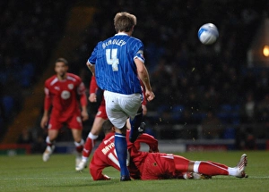 Nicky Maynard slides in on Gareth McAuley