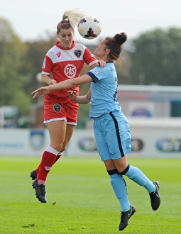 Bawfc Prints: Nicola Watts Battles in Mid-Air: A Moment of Determination in Bristol City FC vs Manchester City Ladies Football Match