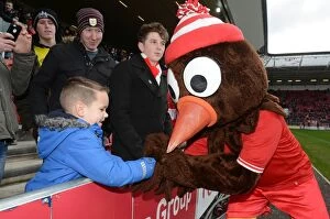 Images Dated 5th March 2016: A Passionate Moment between Scrumpy and a Young Bristol City Fan at Ashton Gate