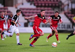 Images Dated 1st August 2012: Paul Anderson Bolts Past Defenders in Pre-Season Friendly: Dunfermline vs. Bristol City