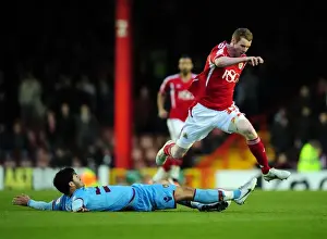 Bristol City V West Ham Prints: Pearson vs. Tomkins: A Tackle Battle at Ashton Gate - Bristol City vs
