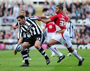 Newcastle Utd V Bristol City Collection: Powerful Duo: Khizanishvili and Saborio in Action - Newcastle United vs. Bristol City
