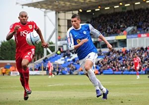 Images Dated 18th February 2012: Race for the Ball: Briggs vs. Elliott in Peterborough United vs. Bristol City Football Match