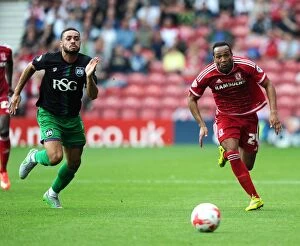 Images Dated 22nd August 2015: Race for the Ball: Derrick Williams vs Emilio Nsue in Middlesbrough vs Bristol City Championship