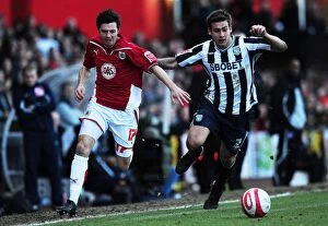 Images Dated 21st February 2010: Race for the Ball: Ivan Sproule vs. Joe Mattock in Bristol City vs