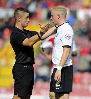 Images Dated 14th September 2013: Referee James Adcock Confers with Craig Alcock of Peterborough United during Bristol City vs