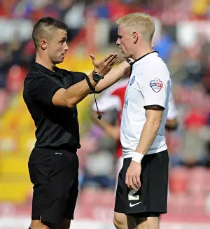 Bristol City V Peterborough Prints: Referee James Adcock Confers with Craig Alcock of Peterborough United during Bristol City vs Peterborough United