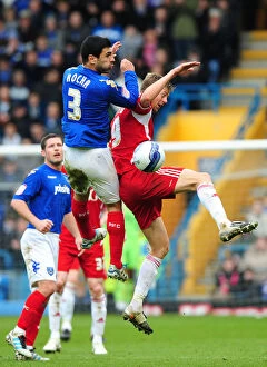 Images Dated 17th March 2012: Rocha vs Stead: Aerial Battle at Fratton Park - Portsmouth vs Bristol City Football Match