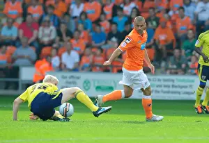 Blackpool V Bristol City Prints: Ryan McGivern vs. Kevin Phillips: Tackle in Blackpool v Bristol City League Cup Match - 01/10/2011