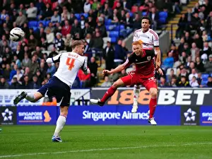 Framed Print : Ryan Taylor's Header: A Pivotal Moment in the 2010-11 Championship Clash Between Bolton Wanderers and Bristol City