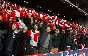 Sea of Scarves: Unified Bristol City Fans in Red and White at Ashton Gate