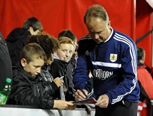 Images Dated 22nd October 2013: Sean O'Driscoll of Bristol City Signs Autographs for Young Fans during Bristol City v Brentford