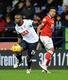Framed Print : Shola Ameobi Slips Past Korey Smith: Intense Moment from Bolton Wanderers vs. Bristol City Championship Clash