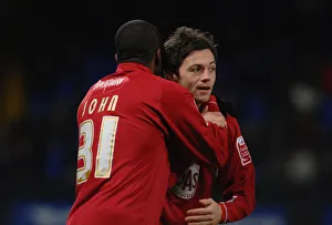 Stern John thanks Ivan Sproule after his cross set