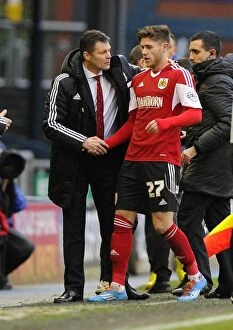 Images Dated 8th February 2014: Steve Cotterill Congratulates Wes Burns: Oldham Athletic vs. Bristol City, 08-02-2014