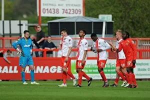 Images Dated 21st April 2014: Stevenage Players Mourn 1-3 Defeat and Relegation to League Two