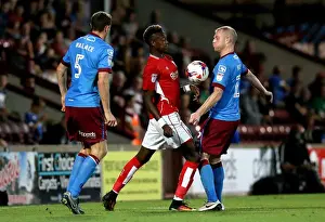 Glanford Park Prints: Tammy Abraham vs Neil Bishop: Intense Battle for the Ball at Glanford Park
