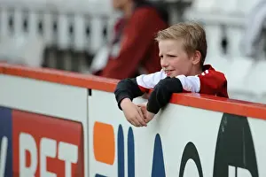 Stevenage V Bristol City Prints: Thrilling Moment: Young Bristol City Fan's Expressive Reaction at Stevenage Match