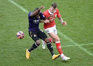 Images Dated 25th January 2015: Valencia Steals the Ball from Flint in Intense Bristol City vs West Ham United FA Cup Clash