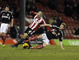 Brentford V Bristol City Prints: Wade Elliott Fouls Alan McCormack: Intense Moment from Brentford vs
