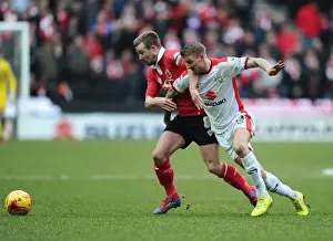 Framed Print : Wade Elliott vs. Carl Baker: Intense Battle for Ball Possession in MK Dons vs. Bristol City Football Match, February 2015