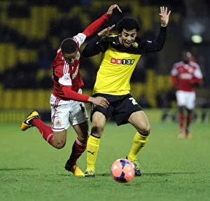 Images Dated 14th January 2014: Watford's Iriney Fouls Bobby Reid in FA Cup Third Round Replay: Watford v Bristol City (14/01/2014)