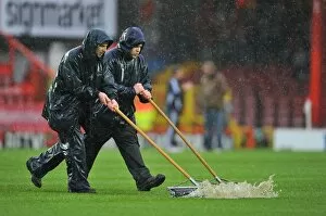 Images Dated 26th December 2012: Winter's Battle: Referee Stops Bristol City vs. Watford Amidst Grounds Crew's Persistent Clearing