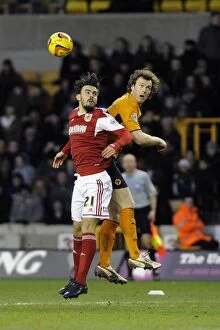 Images Dated 25th January 2014: Wolverhampton Wanderers vs. Bristol City: Intense Aerial Battle Between Kevin McDonald